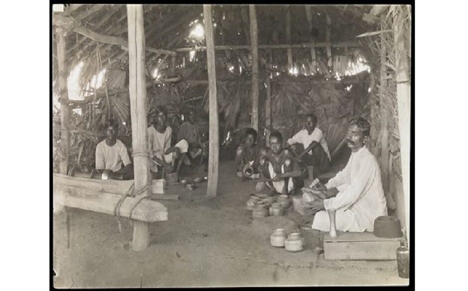 South India: boys and young men with leprosy making brass and copper utensils. Photograph by R. Howett, 19 –. Created between 1900 and 1999. Leprosy – Patients. Brasswork. Copperwork. India. Contributors: R. Howett. Work ID: rn88fz2c.