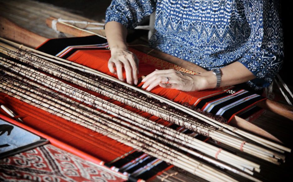 Woman hand-loom weaving