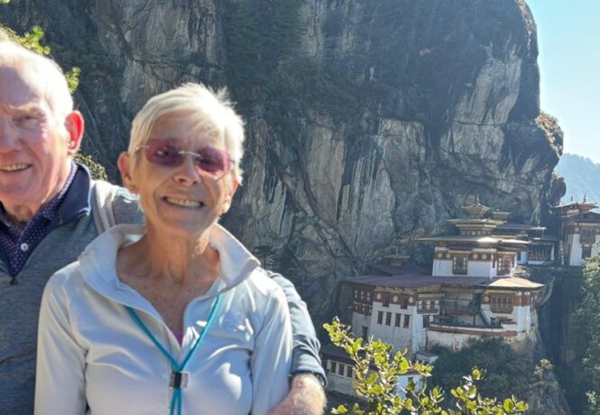 John and Irene's North India and Bhutan tailored tour - John and Irene with Tiger's Nest Monastery in the background