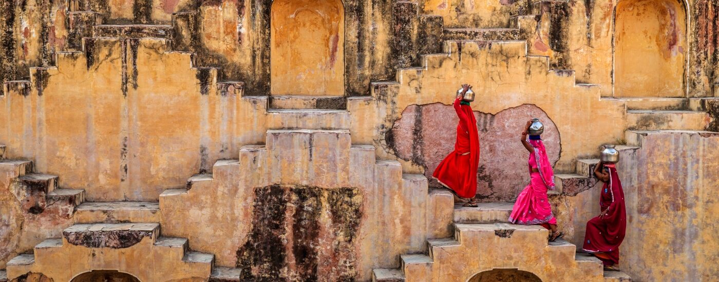 Ultimate Guide to Jaipur - stepwell with women in brightly coloured clothing