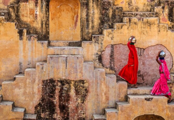 Ultimate Guide to Jaipur - stepwell with women in brightly coloured clothing