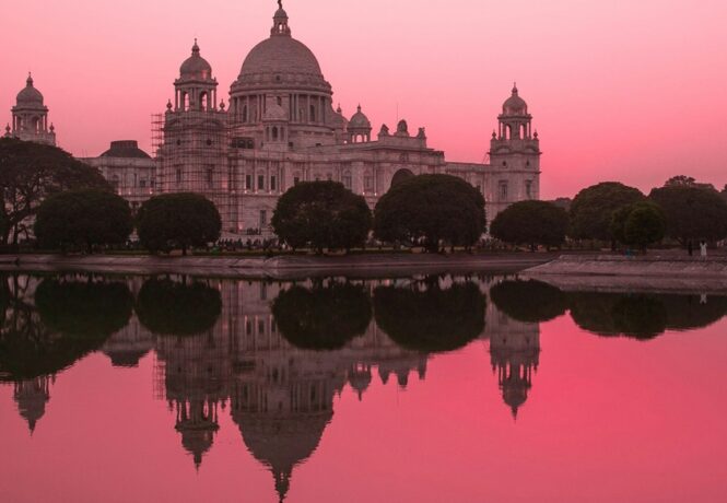 Winter in India - stunning pink sunsey over the Victoria Memorial in Kolkata